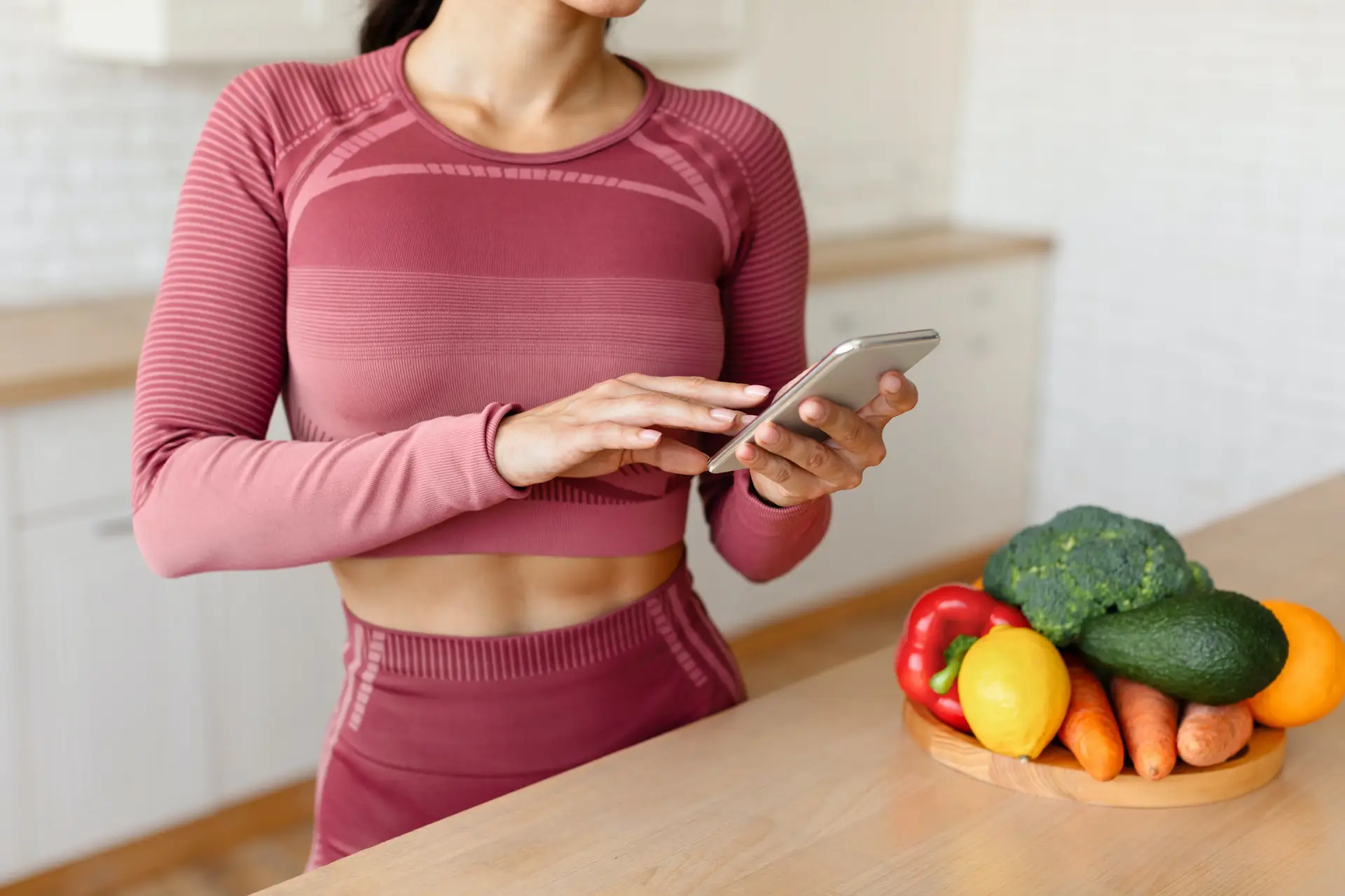 Sporty Lady Using Weight Loss Application On Smartphone Indoors, Cropped