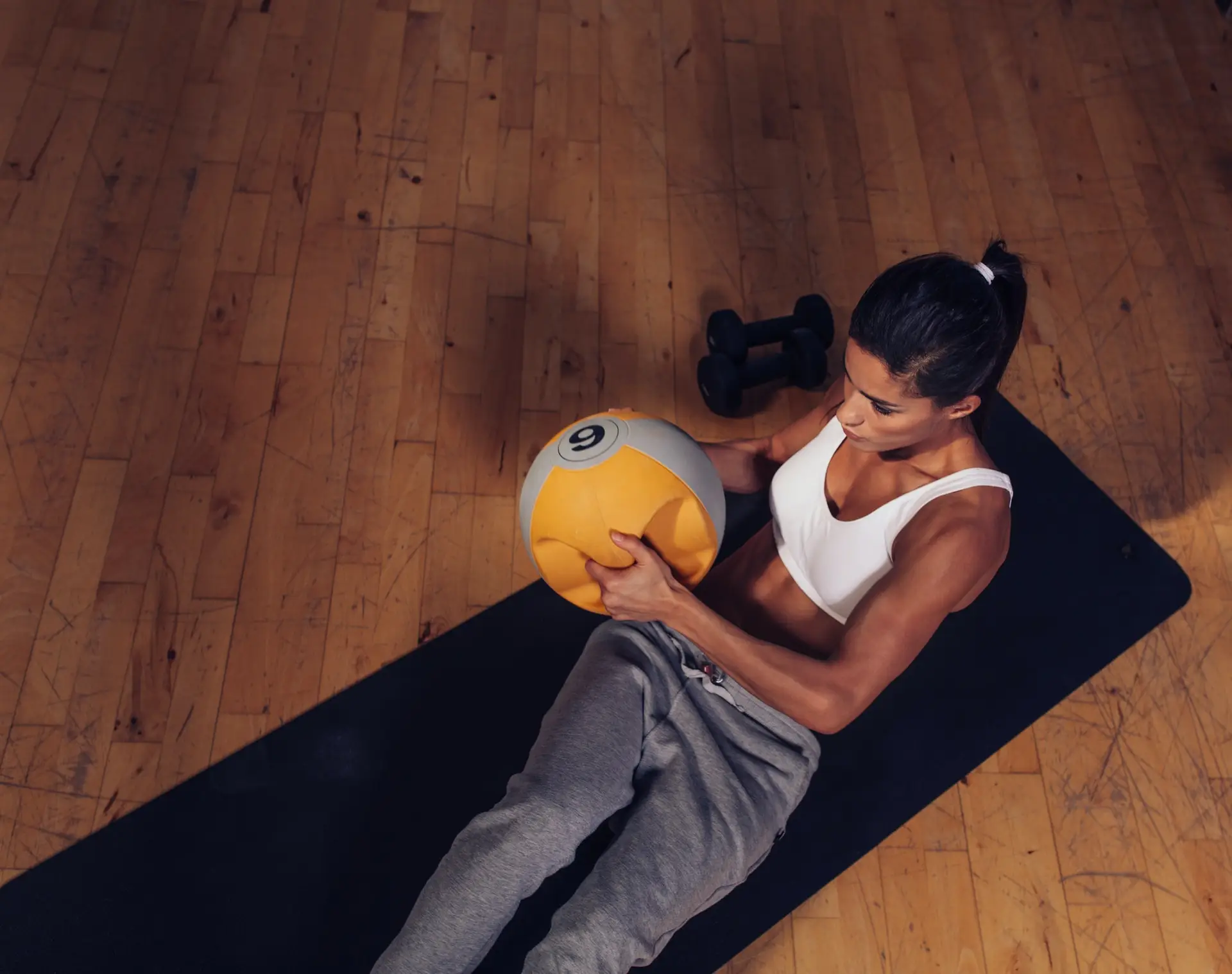 Strong young woman doing core workout